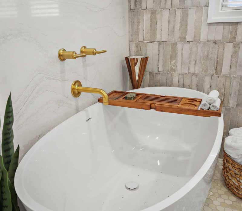 A primary suite was reimagined as a sanctuary of comfort and elegance, while the kids’ bath received a stylish refresh designed to grow with the family.