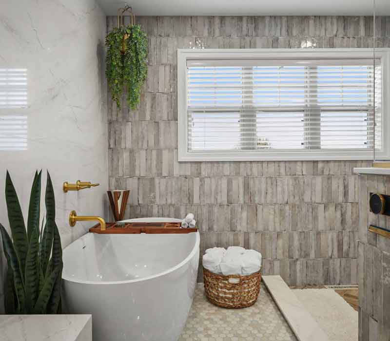 A primary suite was reimagined as a sanctuary of comfort and elegance, while the kids’ bath received a stylish refresh designed to grow with the family.