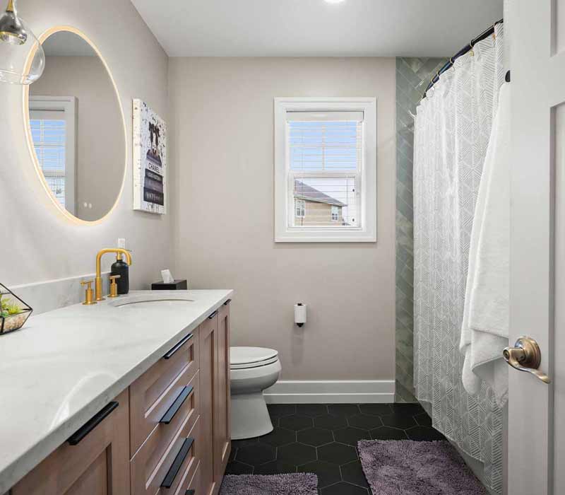 A primary suite was reimagined as a sanctuary of comfort and elegance, while the kids’ bath received a stylish refresh designed to grow with the family.