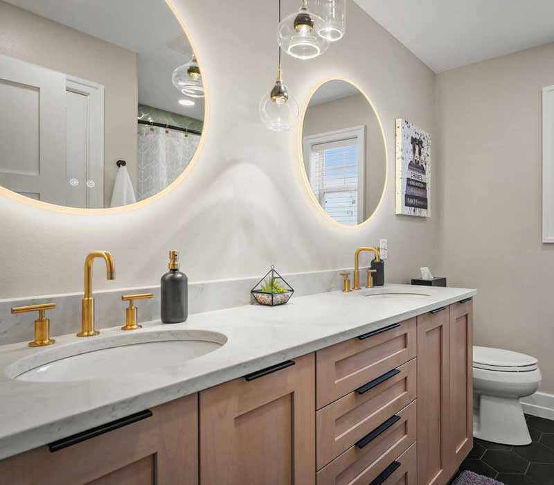 A primary suite was reimagined as a sanctuary of comfort and elegance, while the kids’ bath received a stylish refresh designed to grow with the family.
