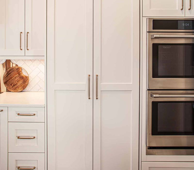 Concealed by what looks like tall cabinet doors, this full walk-in pantry frees up space in the kitchen and provides convenient storage for dry goods, perishables, and cookware alike.