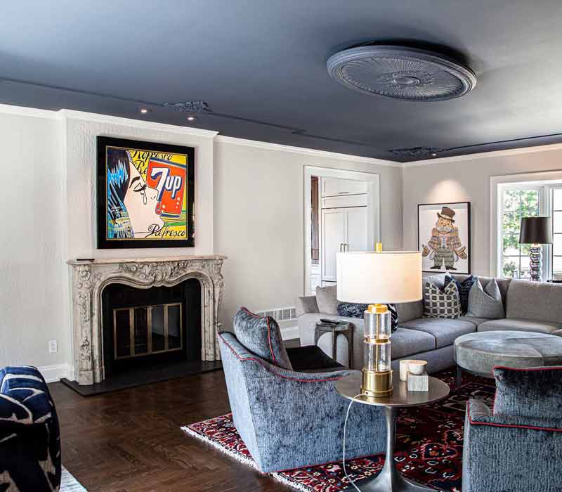 This complete kitchen remodel utilizes timeless materials, an intelligent reconfiguration of the space, and an effortless blend of natural light and warmth. It features cabinetry by DHDK, black quartzite countertops, herringbone wood flooring, a Broan pop-up downdraft hood, and a wet bar.