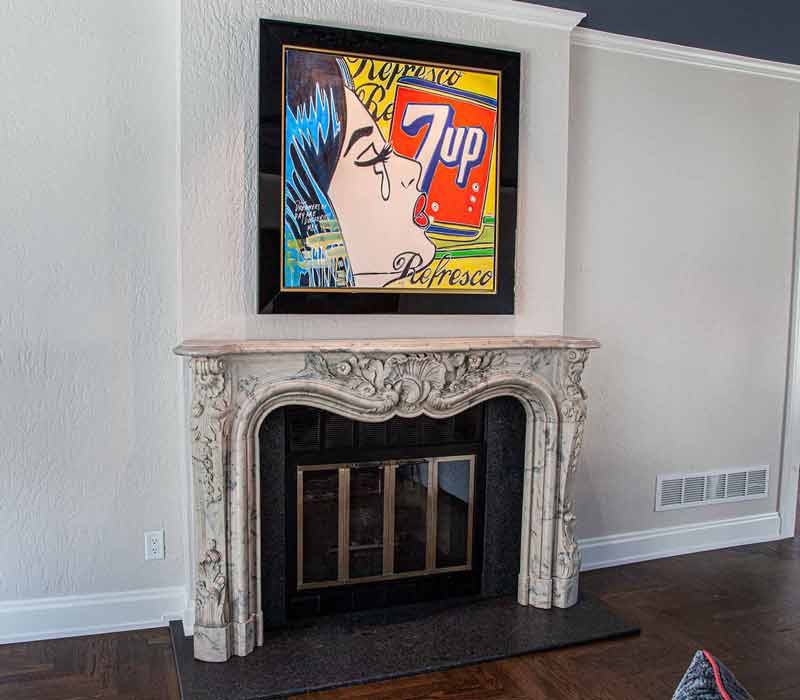 This complete kitchen remodel utilizes timeless materials, an intelligent reconfiguration of the space, and an effortless blend of natural light and warmth. It features cabinetry by DHDK, black quartzite countertops, herringbone wood flooring, a Broan pop-up downdraft hood, and a wet bar.