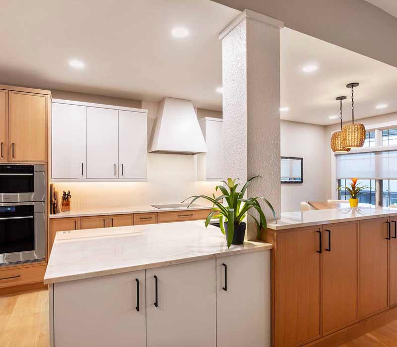This full kitchen remodel blends natural warmth with refined modernity, crafting a space that is as inviting as it is impeccably tailored. It features custom DHDK cabinetry, Taj Majal quartzite, Bosch stainless steel appliances, and intuitive storage options.