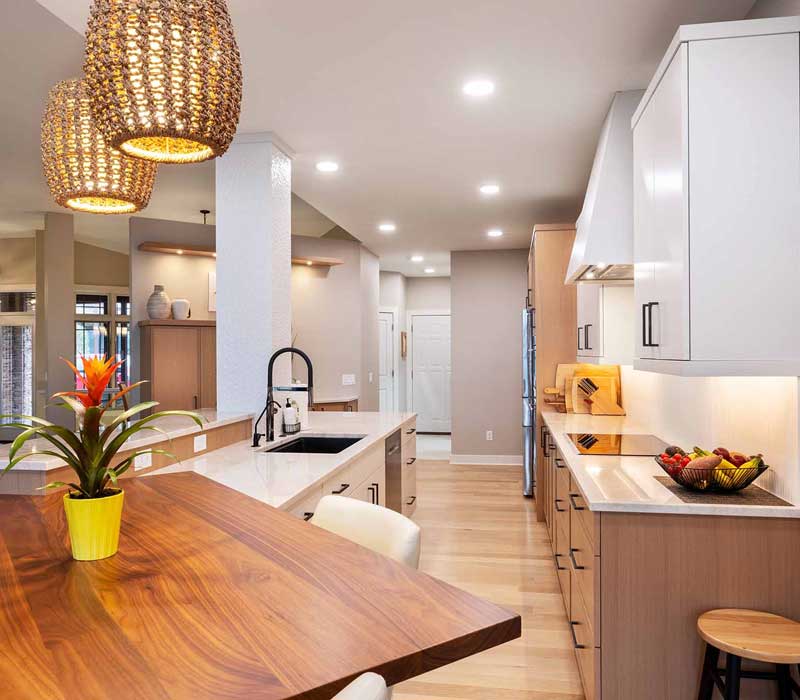 This full kitchen remodel blends natural warmth with refined modernity, crafting a space that is as inviting as it is impeccably tailored. It features custom DHDK cabinetry, Taj Majal quartzite, Bosch stainless steel appliances, and intuitive storage options.