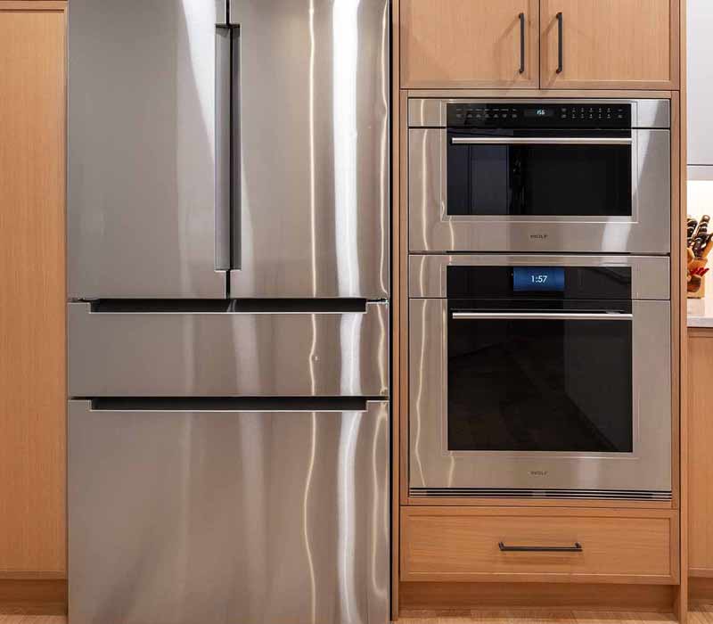 This full kitchen remodel blends natural warmth with refined modernity, crafting a space that is as inviting as it is impeccably tailored. It features custom DHDK cabinetry, Taj Majal quartzite, Bosch stainless steel appliances, and intuitive storage options.