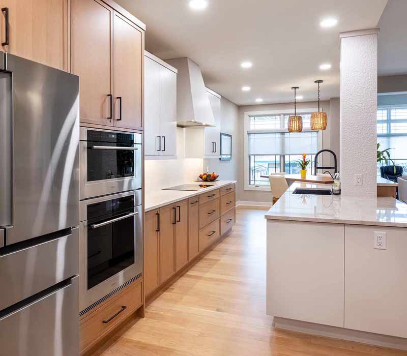 This full kitchen remodel blends natural warmth with refined modernity, crafting a space that is as inviting as it is impeccably tailored. It features custom DHDK cabinetry, Taj Majal quartzite, Bosch stainless steel appliances, and intuitive storage options.