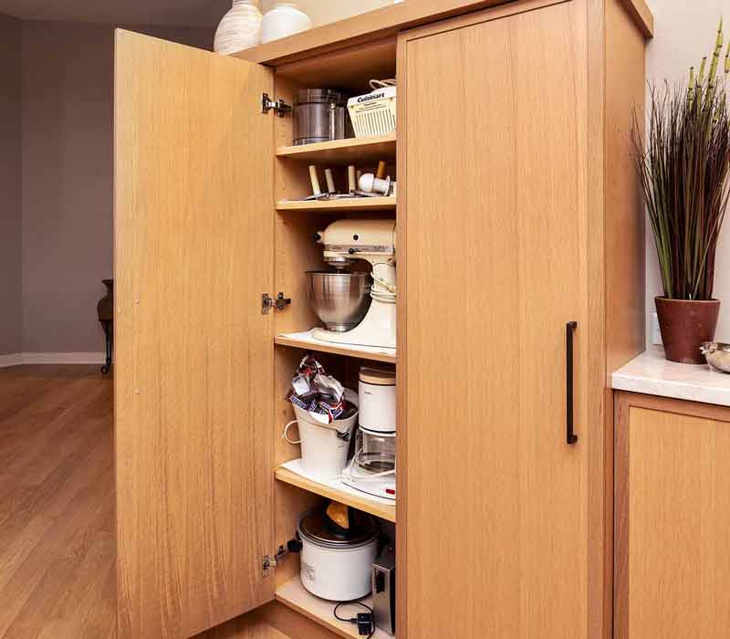 This full kitchen remodel blends natural warmth with refined modernity, crafting a space that is as inviting as it is impeccably tailored. It features custom DHDK cabinetry, Taj Majal quartzite, Bosch stainless steel appliances, and intuitive storage options.