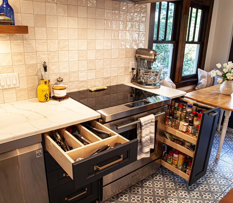 Dark woodwork, patterned terra cotta tile floors, and exposed brick interior walls define the kitchen and addition of this Craftsman home.