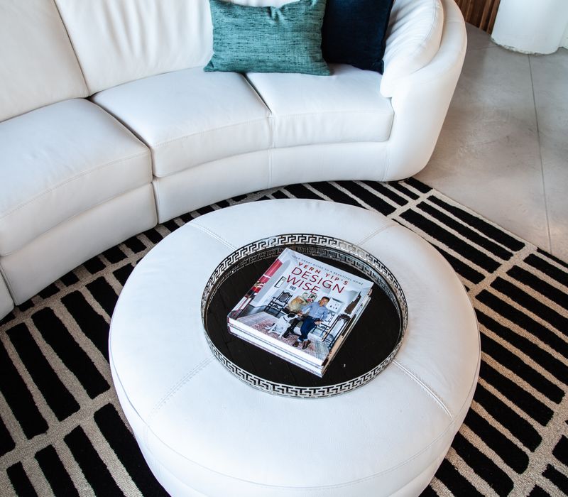 White and stainless steel dominate in this minimalist condo showcasing contemporary artwork. 