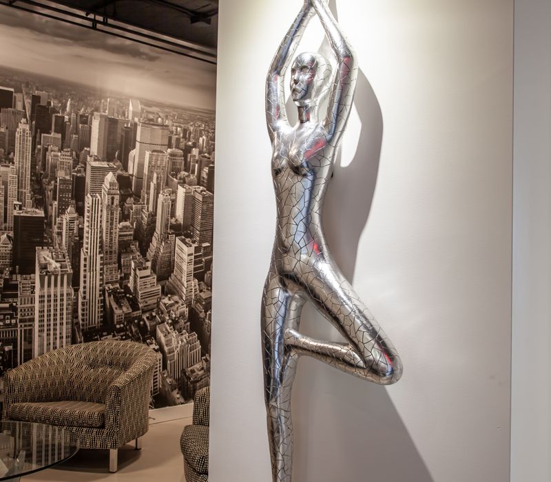 White and stainless steel dominate in this minimalist condo showcasing contemporary artwork. 