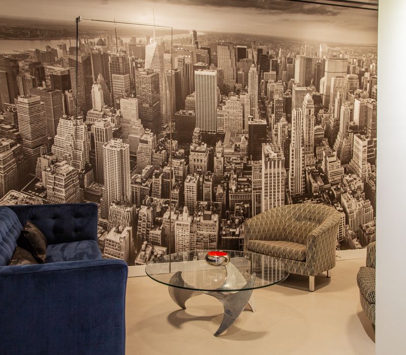 White and stainless steel dominate in this minimalist condo showcasing contemporary artwork. 