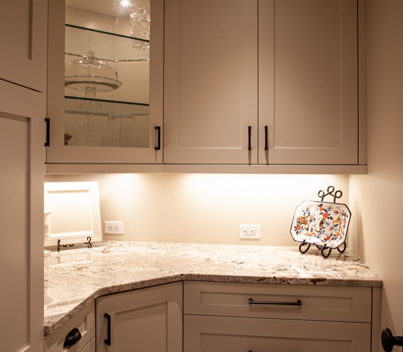 This country home has a rustic chic style with rough-hewn exposed wood beams, hand-painted terra cotta tiles, and a stone turret.