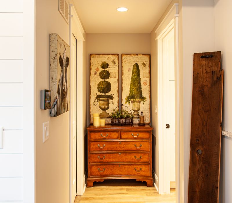 This country home has a rustic chic style with rough-hewn exposed wood beams, hand-painted terra cotta tiles, and a stone turret.