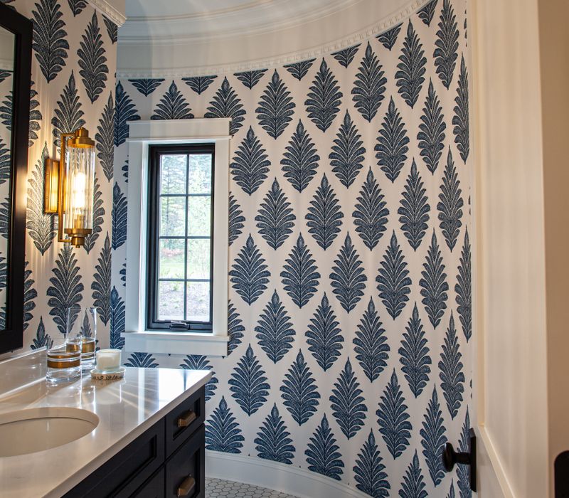 This country home has a rustic chic style with rough-hewn exposed wood beams, hand-painted terra cotta tiles, and a stone turret.