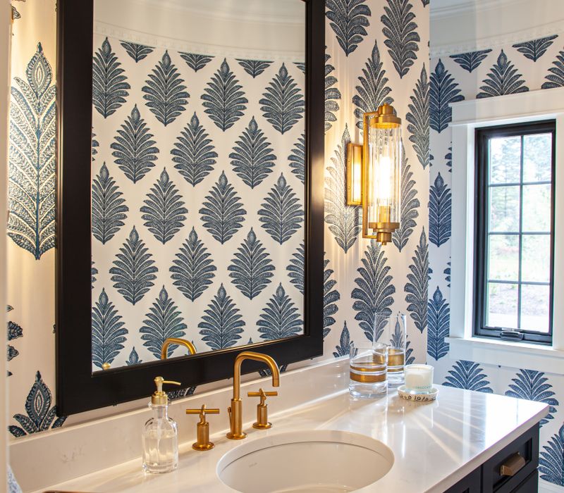 This country home has a rustic chic style with rough-hewn exposed wood beams, hand-painted terra cotta tiles, and a stone turret.