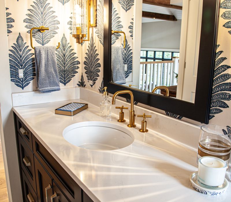 This country home has a rustic chic style with rough-hewn exposed wood beams, hand-painted terra cotta tiles, and a stone turret.