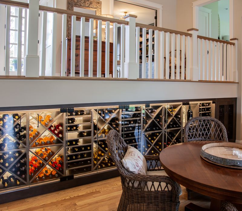 This country home has a rustic chic style with rough-hewn exposed wood beams, hand-painted terra cotta tiles, and a stone turret.