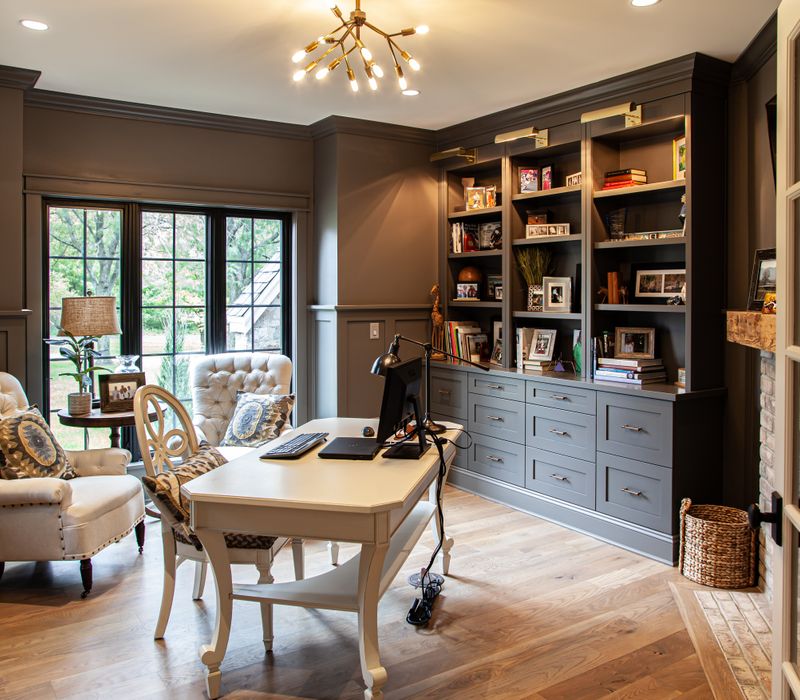 This country home has a rustic chic style with rough-hewn exposed wood beams, hand-painted terra cotta tiles, and a stone turret.