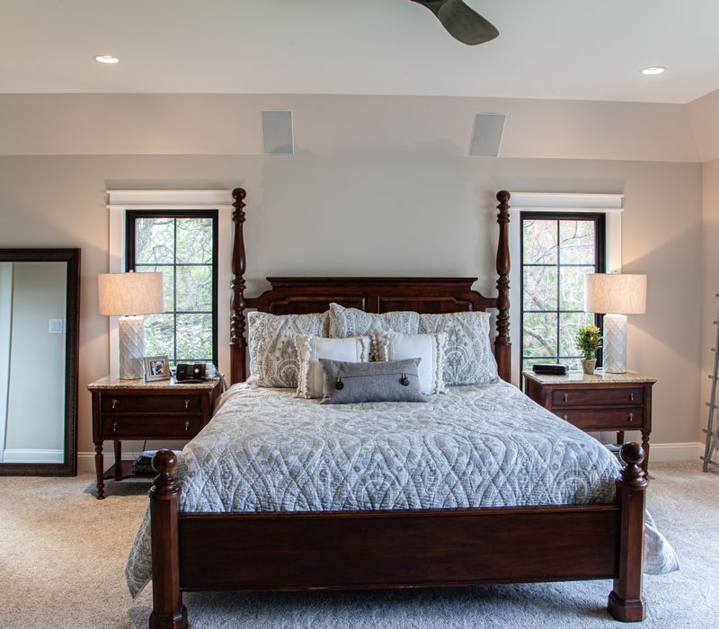 This country home has a rustic chic style with rough-hewn exposed wood beams, hand-painted terra cotta tiles, and a stone turret.