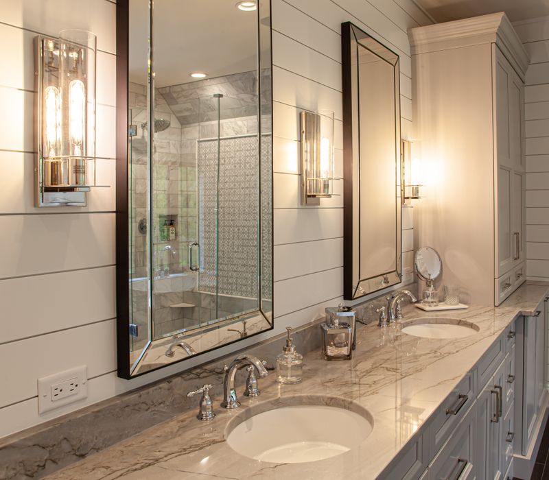 This country home has a rustic chic style with rough-hewn exposed wood beams, hand-painted terra cotta tiles, and a stone turret.