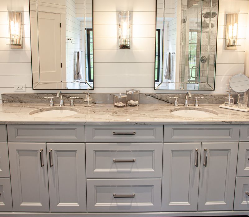 This country home has a rustic chic style with rough-hewn exposed wood beams, hand-painted terra cotta tiles, and a stone turret.