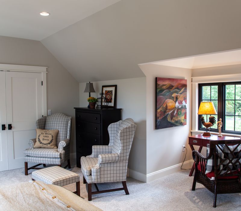 This country home has a rustic chic style with rough-hewn exposed wood beams, hand-painted terra cotta tiles, and a stone turret.