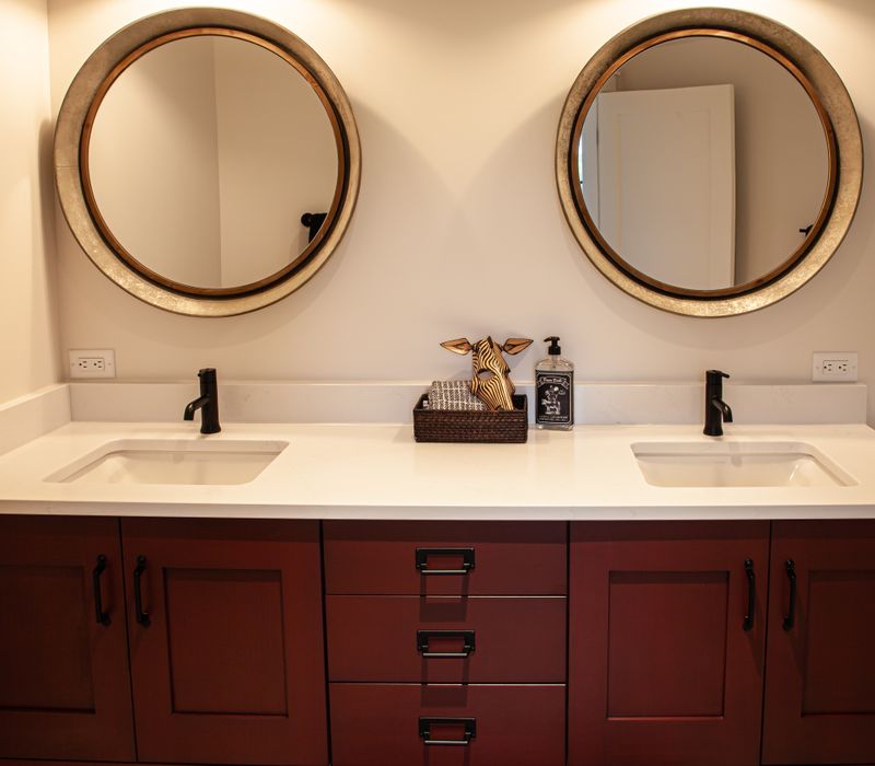 This country home has a rustic chic style with rough-hewn exposed wood beams, hand-painted terra cotta tiles, and a stone turret.