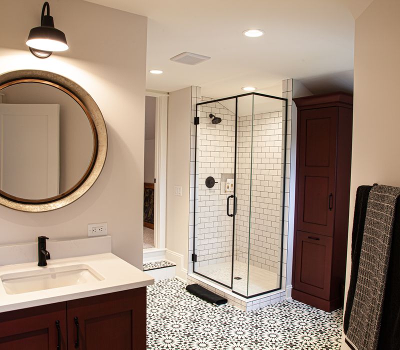 This country home has a rustic chic style with rough-hewn exposed wood beams, hand-painted terra cotta tiles, and a stone turret.