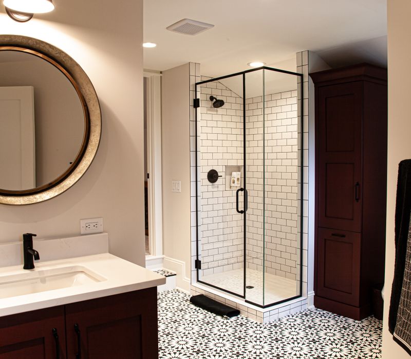 This country home has a rustic chic style with rough-hewn exposed wood beams, hand-painted terra cotta tiles, and a stone turret.