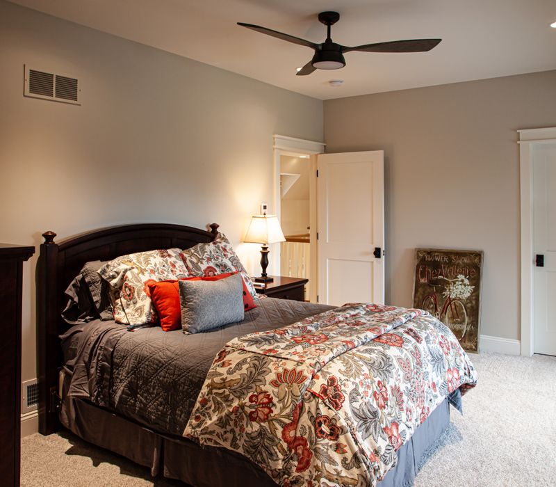 This country home has a rustic chic style with rough-hewn exposed wood beams, hand-painted terra cotta tiles, and a stone turret.