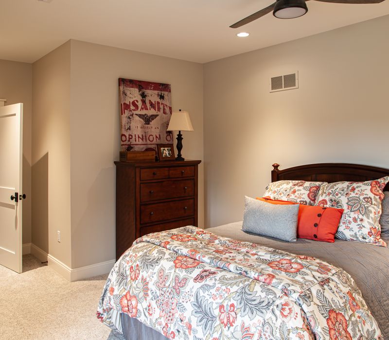 This country home has a rustic chic style with rough-hewn exposed wood beams, hand-painted terra cotta tiles, and a stone turret.