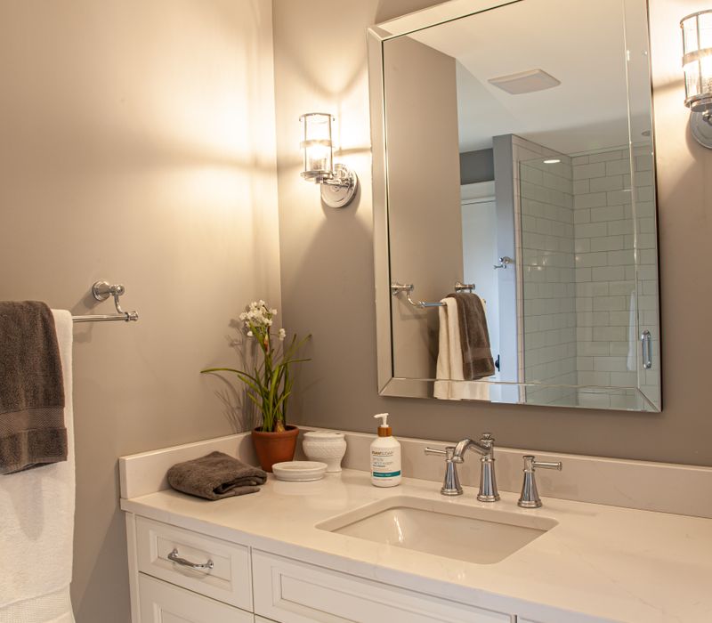 This country home has a rustic chic style with rough-hewn exposed wood beams, hand-painted terra cotta tiles, and a stone turret.