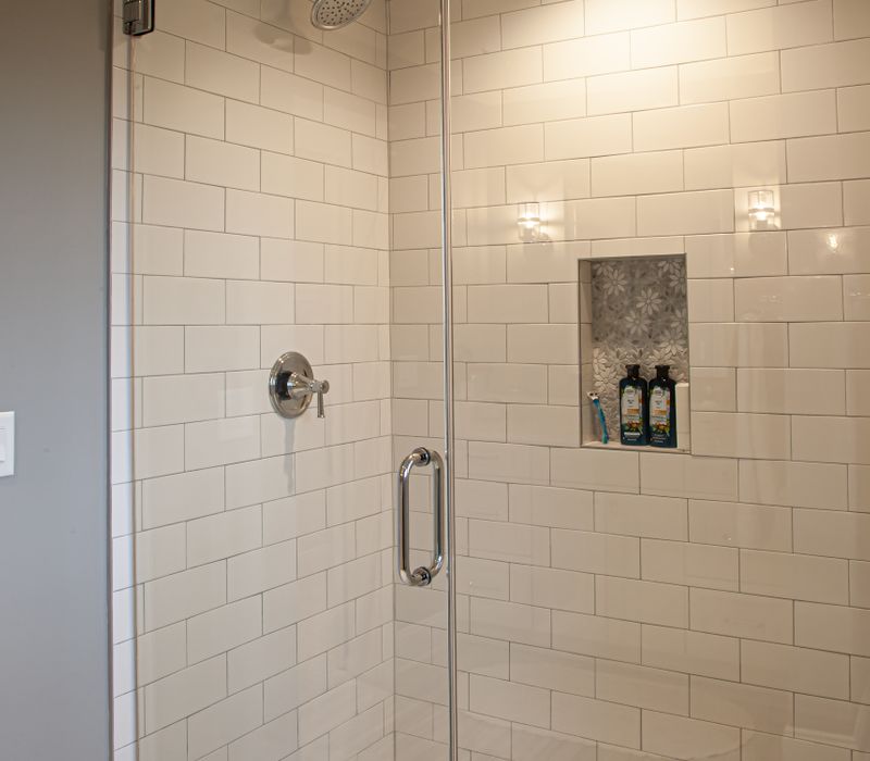 This country home has a rustic chic style with rough-hewn exposed wood beams, hand-painted terra cotta tiles, and a stone turret.