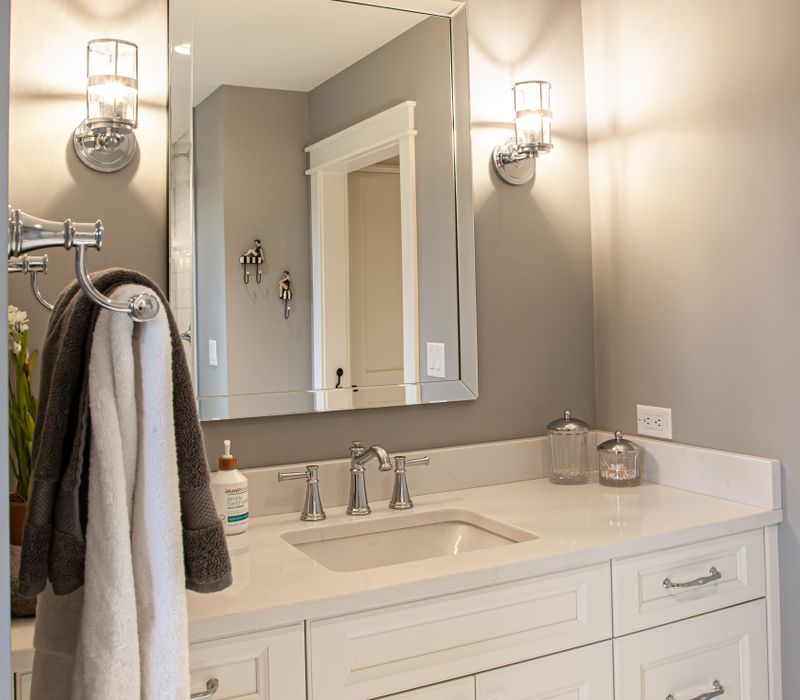 This country home has a rustic chic style with rough-hewn exposed wood beams, hand-painted terra cotta tiles, and a stone turret.