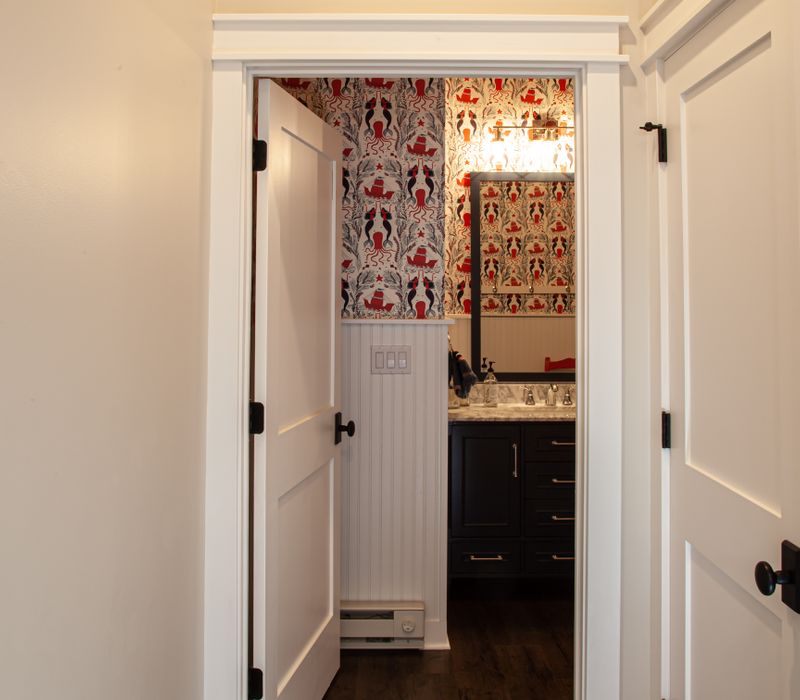 This country home has a rustic chic style with rough-hewn exposed wood beams, hand-painted terra cotta tiles, and a stone turret.