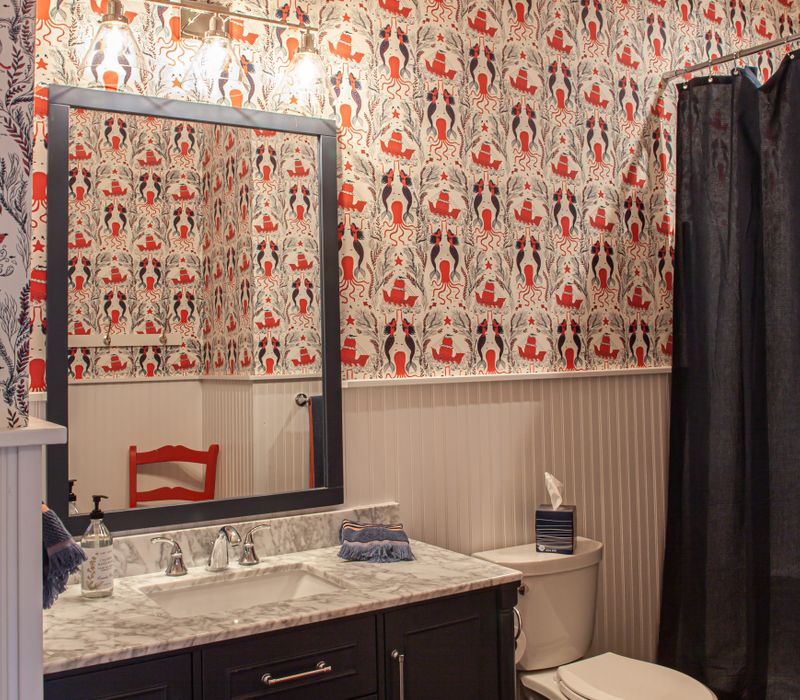 This country home has a rustic chic style with rough-hewn exposed wood beams, hand-painted terra cotta tiles, and a stone turret.