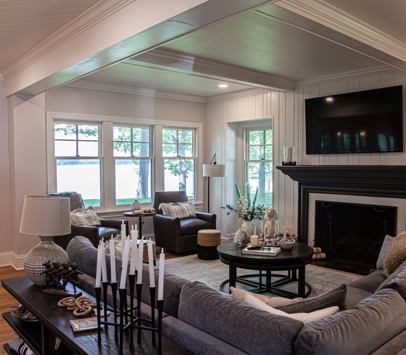 Subway tiles, white cabinetry, and coffered and beadboard ceilings add a sophisticated touch to this comfortable classic home. 