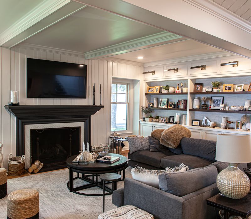 Subway tiles, white cabinetry, and coffered and beadboard ceilings add a sophisticated touch to this comfortable classic home. 