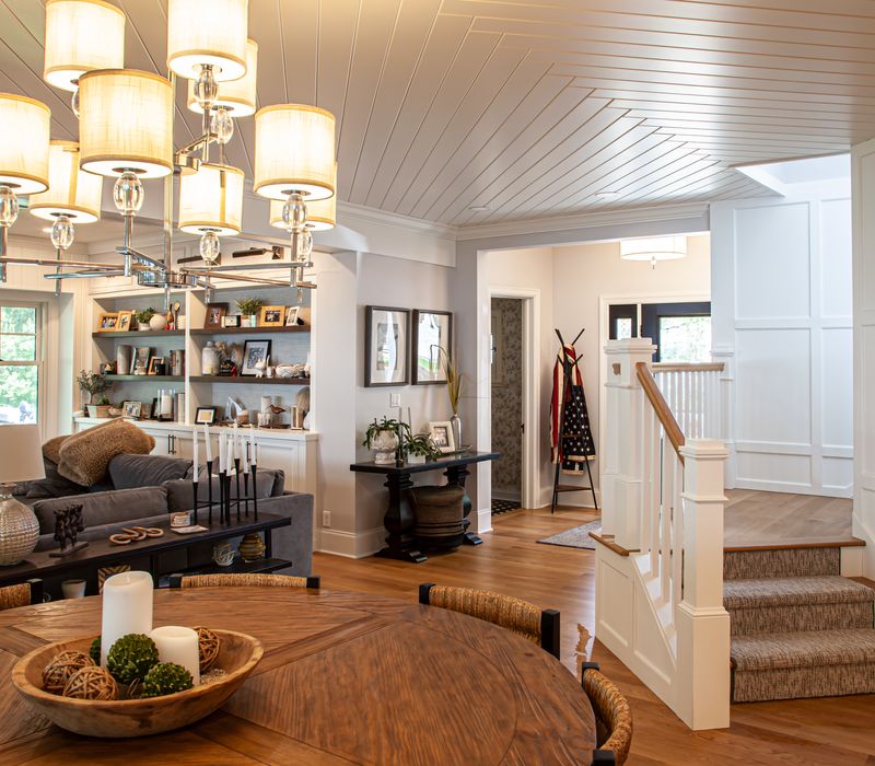 Subway tiles, white cabinetry, and coffered and beadboard ceilings add a sophisticated touch to this comfortable classic home. 