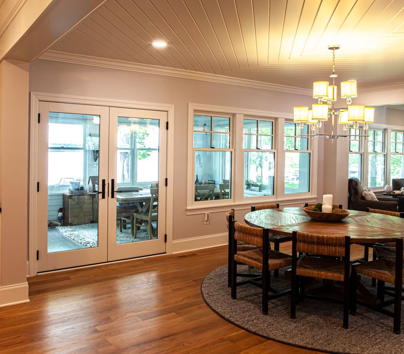 Subway tiles, white cabinetry, and coffered and beadboard ceilings add a sophisticated touch to this comfortable classic home. 
