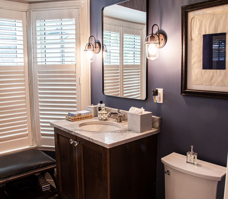 Subway tiles, white cabinetry, and coffered and beadboard ceilings add a sophisticated touch to this comfortable classic home. 