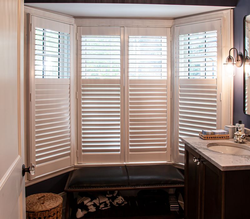 Subway tiles, white cabinetry, and coffered and beadboard ceilings add a sophisticated touch to this comfortable classic home. 