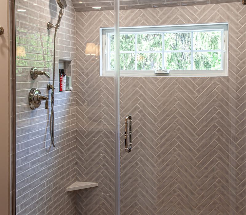 Subway tiles, white cabinetry, and coffered and beadboard ceilings add a sophisticated touch to this comfortable classic home. 