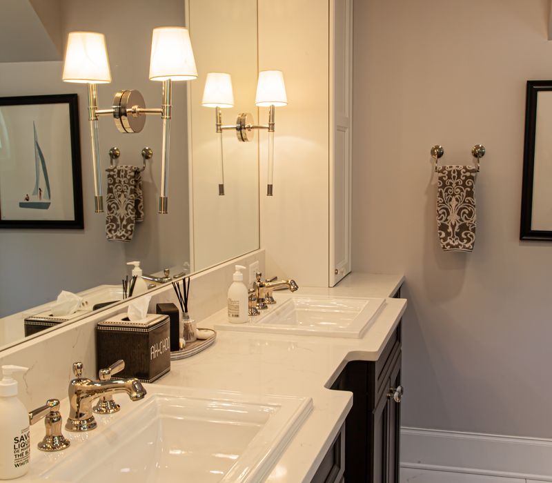 Subway tiles, white cabinetry, and coffered and beadboard ceilings add a sophisticated touch to this comfortable classic home. 