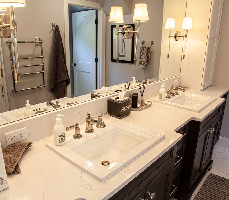 Subway tiles, white cabinetry, and coffered and beadboard ceilings add a sophisticated touch to this comfortable classic home. 