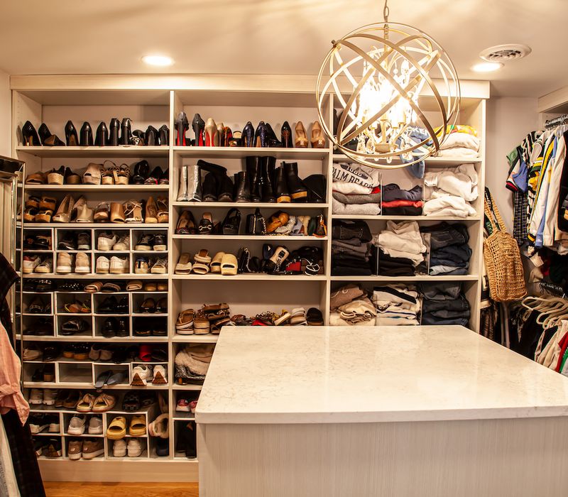 Subway tiles, white cabinetry, and coffered and beadboard ceilings add a sophisticated touch to this comfortable classic home. 