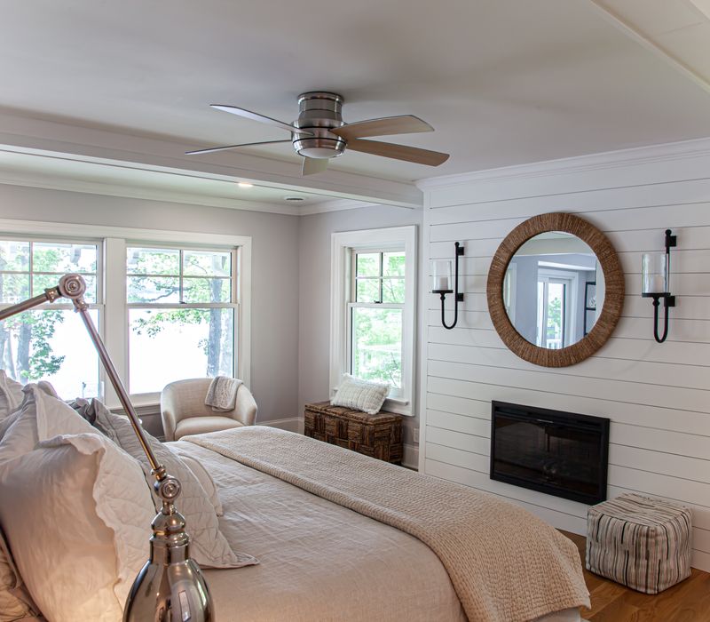 Subway tiles, white cabinetry, and coffered and beadboard ceilings add a sophisticated touch to this comfortable classic home. 