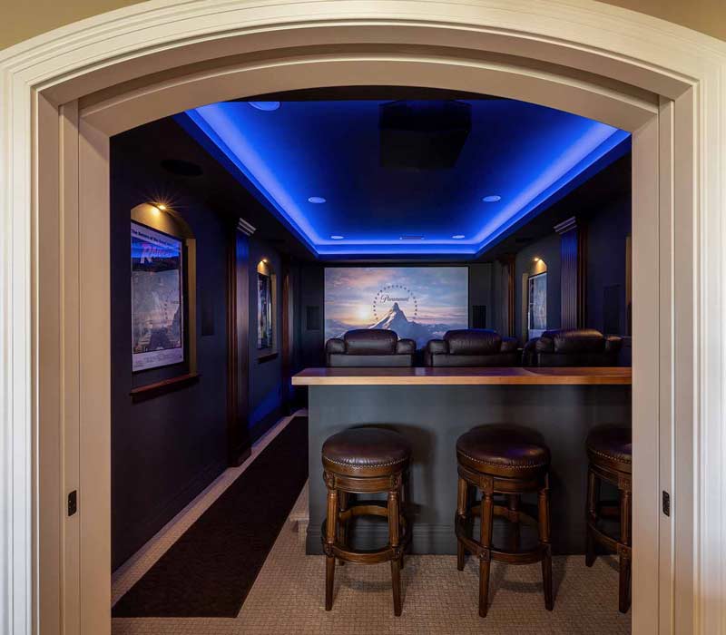 We transformed this basement into a luxurious retreat complete with a theater room, family room, bar, and game room. The remodel employs a traditional style and elevates everyday living.