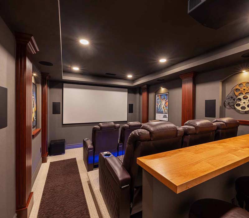 We transformed this basement into a luxurious retreat complete with a theater room, family room, bar, and game room. The remodel employs a traditional style and elevates everyday living.